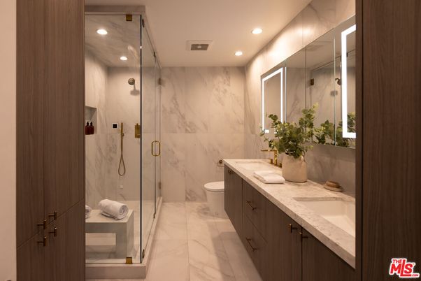 Bathroom, Dual Sink Vanities, Glass Shower, Interior, Marble, Marble Walls, Recessed Lighting