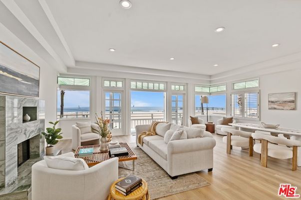 Dining room, Fireplace, Interior, Living room, Recessed Lighting, Water, Wood Texture Flooring