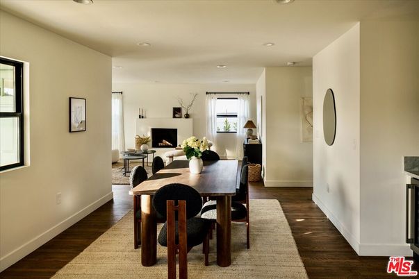 Dining room, Fireplace, Interior, Living room, Recessed Lighting, Wood Texture Flooring
