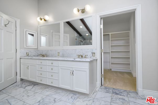 Bathroom, Dual Sink Vanities, Interior, Marble, Recessed Lighting, Walk-in Closets