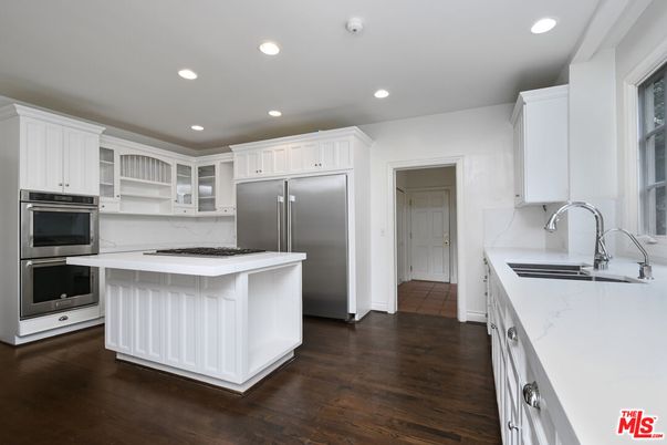 Interior, Kitchen, Marble Walls, Recessed Lighting, Stainless Steel Appliances, Wood Texture Flooring