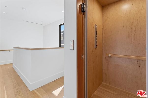 Elevator, Interior, Recessed Lighting, Wood Texture Flooring, Wooden Walls