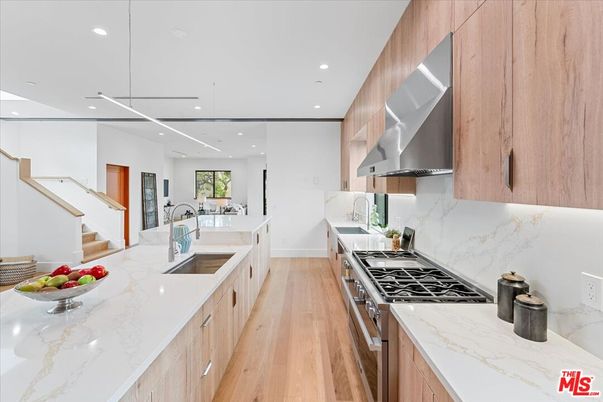 Interior, Kitchen, Marble Walls, Pendant Lights, Recessed Lighting, Stainless Steel Appliances, Wood Texture Flooring