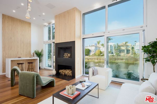 Fireplace, Interior, Living room, Pendant Lights, Recessed Lighting, Water, Wood Texture Flooring