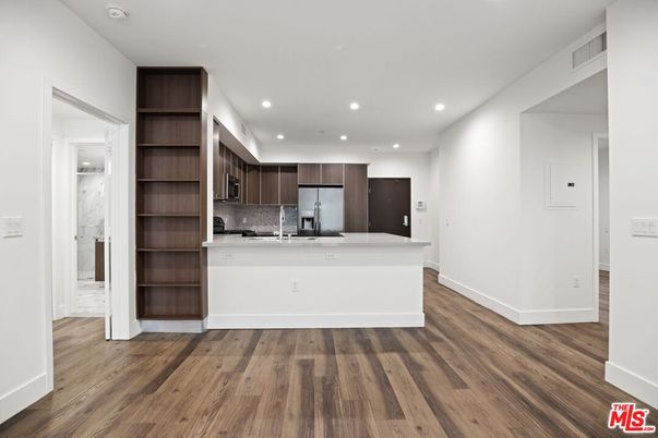 Interior, Kitchen, Marble Walls, Recessed Lighting, Stainless Steel Appliances, Wood Texture Flooring