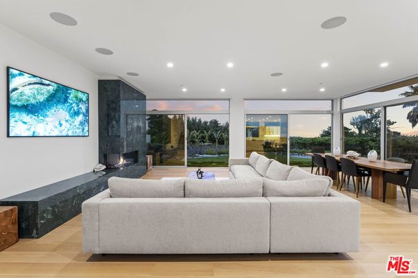 Dining room, Fireplace, Interior, Living room, Recessed Lighting, Wood Texture Flooring
