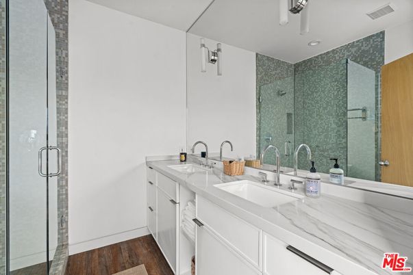 Bathroom, Dual Sink Vanities, Glass Shower, Interior, Recessed Lighting, Wood Texture Flooring