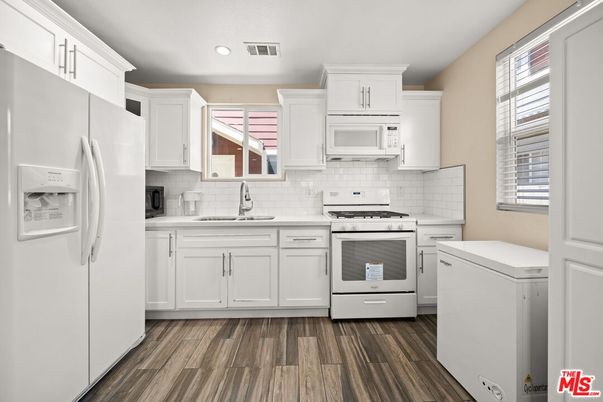 Interior, Kitchen, Recessed Lighting, Stainless Steel Appliances, Washer, Wood Texture Flooring