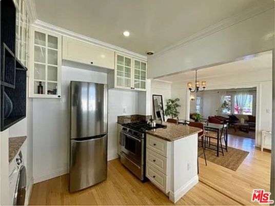 Chandelier, Dining room, Interior, Kitchen, Living room, Recessed Lighting, Stainless Steel Appliances, Wood Texture Flooring