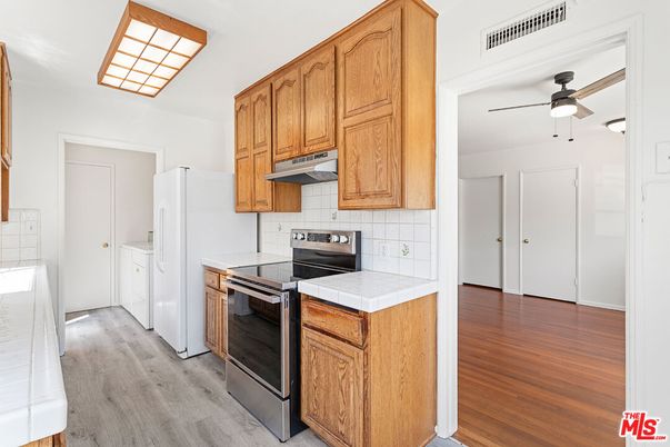 Interior, Kitchen, Tile Countertops, Wood Texture Flooring