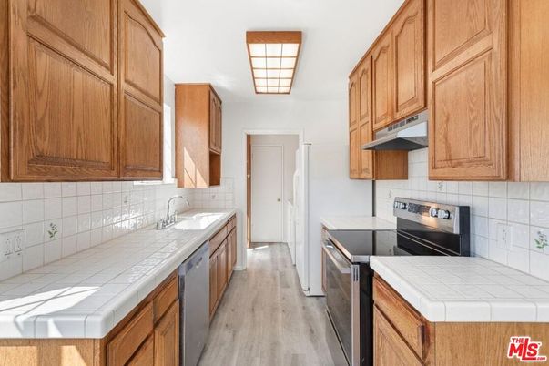 Interior, Kitchen, Tile Countertops, Wood Texture Flooring