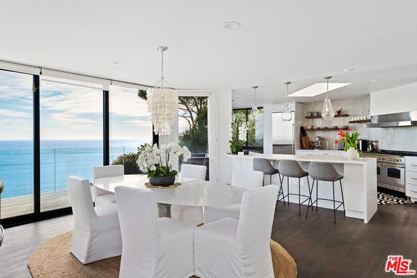 Chandelier, Dining room, Interior, Kitchen, Pendant Lights, Recessed Lighting, Stainless Steel Appliances, Water, Wood Texture Flooring