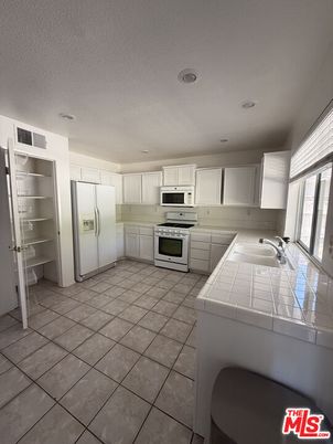 Interior, Kitchen, Recessed Lighting, Tile Countertops