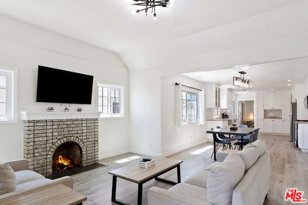 Chandelier, Dining room, Fireplace, Interior, Kitchen, Living room, Pendant Lights, Recessed Lighting, Wood Texture Flooring