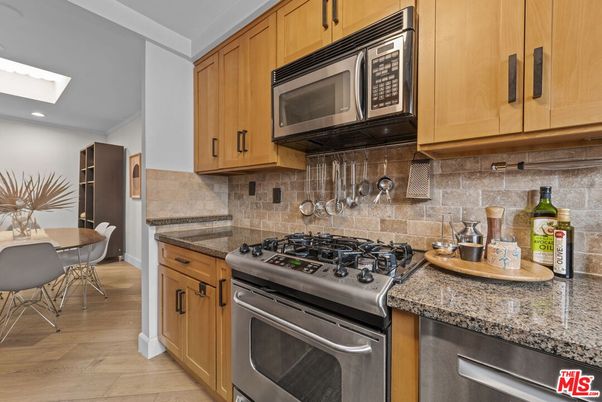 Dining room, Interior, Kitchen, Recessed Lighting, Stainless Steel Appliances, Wood Texture Flooring