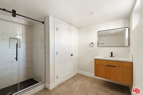 Bathroom, Dual Sink Vanities, Glass Shower, Interior, Marble Walls, Recessed Lighting