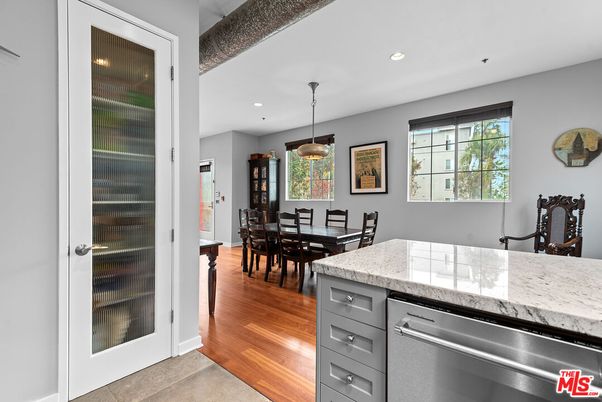 Dining room, Interior, Kitchen, Pendant Lights, Recessed Lighting, Stainless Steel Appliances, Wood Texture Flooring