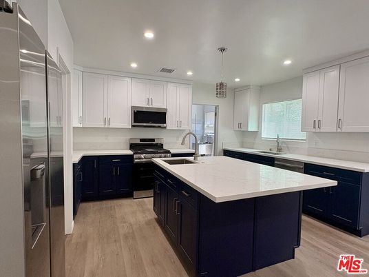 Interior, Kitchen, Pendant Lights, Recessed Lighting, Stainless Steel Appliances, Wood Texture Flooring