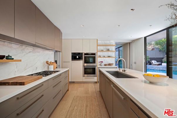 Interior, Kitchen, Marble Walls, Recessed Lighting, Stainless Steel Appliances, Wood Texture Flooring