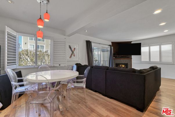 Dining room, Fireplace, Interior, Living room, Pendant Lights, Recessed Lighting, Wood Texture Flooring