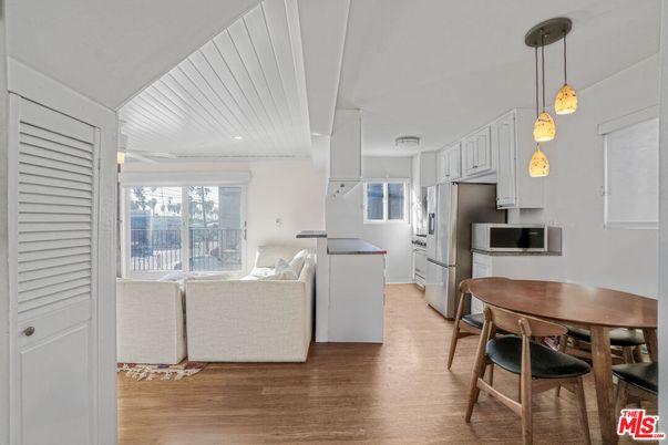 Dining room, Interior, Kitchen, Pendant Lights, Recessed Lighting, Stainless Steel Appliances, Wood Texture Flooring