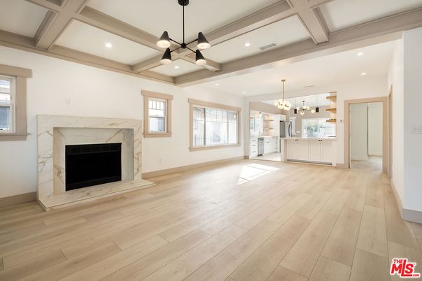Empty room, Fireplace, Interior, Kitchen, Pendant Lights, Recessed Lighting, Wood Texture Flooring