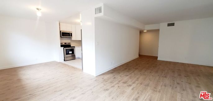 Empty room, Interior, Kitchen, Stainless Steel Appliances, Wood Texture Flooring