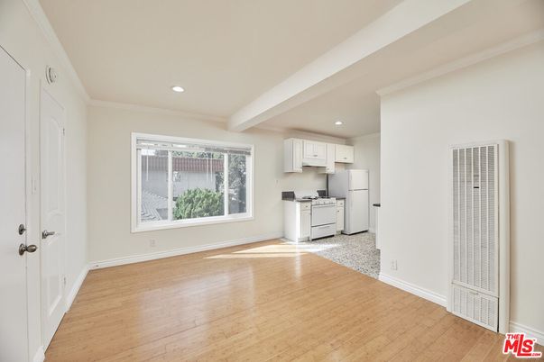Interior, Kitchen, Recessed Lighting, Washer, Wood Texture Flooring