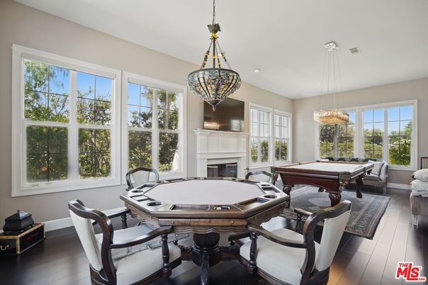 Billiard Table, Dining room, Fireplace, Game Room, Interior, Pendant Lights, Recessed Lighting, Wood Texture Flooring