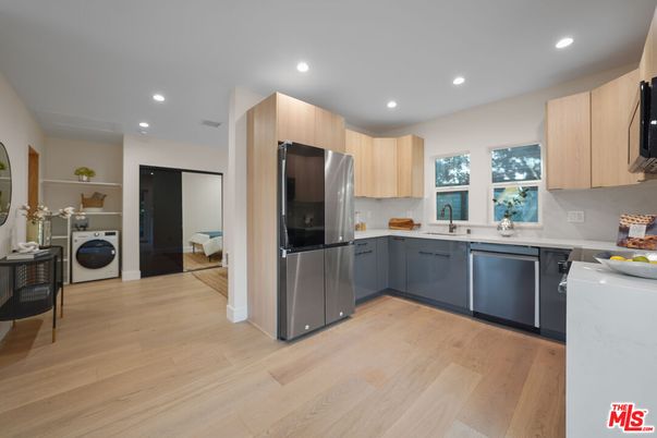 Interior, Kitchen, Recessed Lighting, Washer, Wood Texture Flooring
