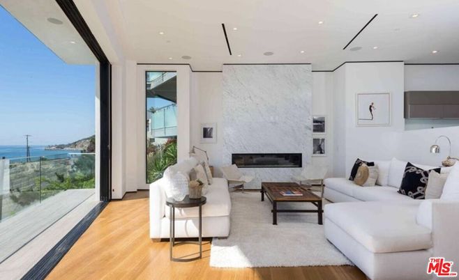 Fireplace, Interior, Living room, Marble Walls, Recessed Lighting, Water, Wood Texture Flooring