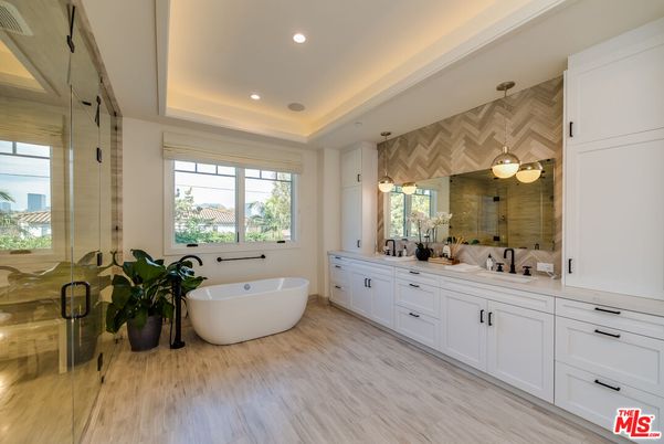 Bathroom, Dual Sink Vanities, Free Standing Baths, Glass Shower, Interior, Recessed Lighting, Wood Texture Flooring