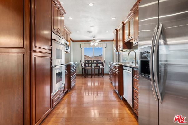 Dining room, Interior, Kitchen, Recessed Lighting, Stainless Steel Appliances, Wood Texture Flooring