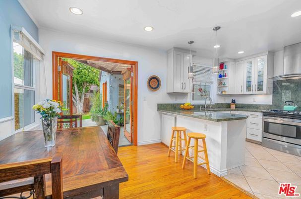 Dining room, Interior, Kitchen, Pendant Lights, Recessed Lighting, Stainless Steel Appliances, Wood Texture Flooring