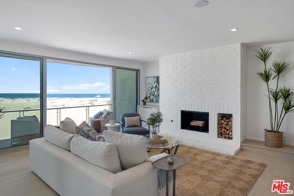 Fireplace, Interior, Living room, Recessed Lighting, Stone Walls, Water, Wood Texture Flooring