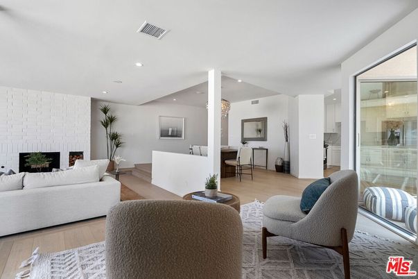 Dining room, Fireplace, Interior, Living room, Recessed Lighting, Wood Texture Flooring