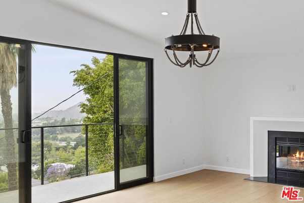 Chandelier, Empty room, Fireplace, Interior, Recessed Lighting, Wood Texture Flooring