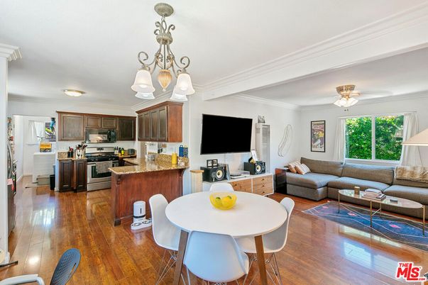 Chandelier, Dining room, Interior, Kitchen, Living room, Stainless Steel Appliances, Wood Texture Flooring