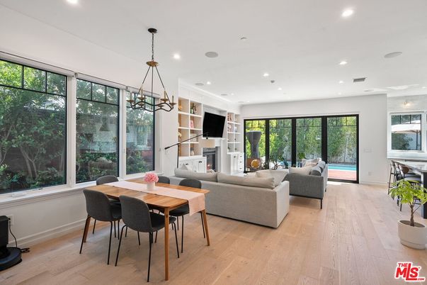 Dining room, Fireplace, Interior, Living room, Pendant Lights, Recessed Lighting, Wood Texture Flooring