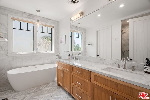 Bathroom, Dual Sink Vanities, Free Standing Baths, Interior, Marble Walls, Pendant Lights, Recessed Lighting