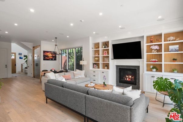 Dining room, Fireplace, Interior, Living room, Pendant Lights, Recessed Lighting, Wood Texture Flooring
