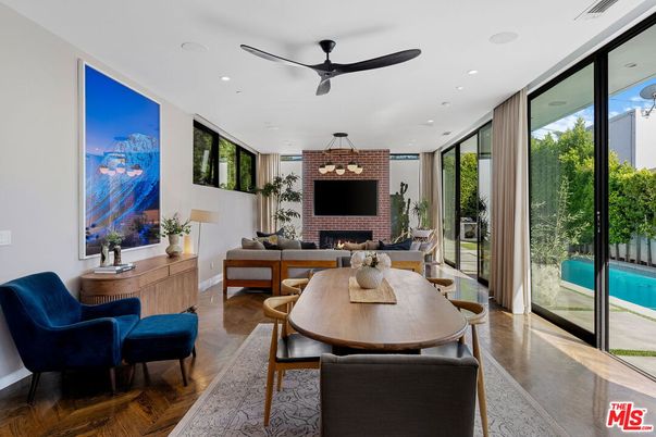 Dining room, Fireplace, Interior, Living room, Recessed Lighting, Stone Walls, Wood Texture Flooring