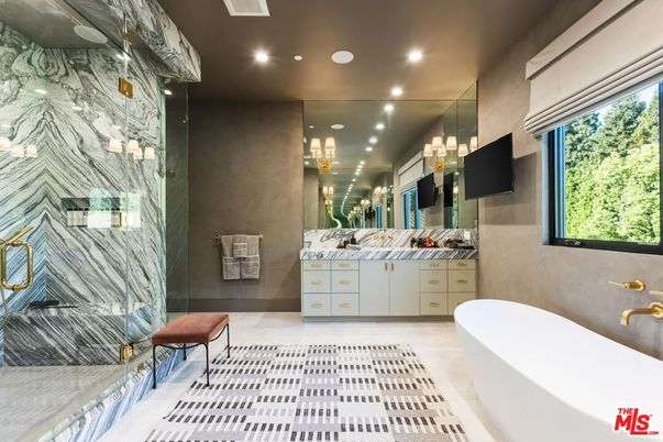 Bathroom, Dual Sink Vanities, Free Standing Baths, Glass Shower, Interior, Marble Walls, Pendant Lights, Recessed Lighting