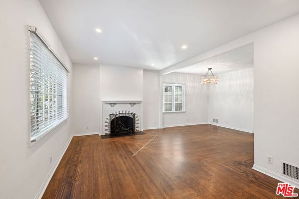 Chandelier, Empty room, Fireplace, Interior, Recessed Lighting, Wood Texture Flooring