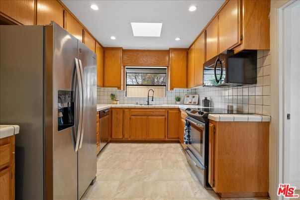 Interior, Kitchen, Recessed Lighting, Stainless Steel Appliances, Tile Countertops