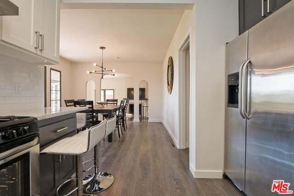 Dining room, Interior, Kitchen, Pendant Lights, Stainless Steel Appliances, Stone Walls, Wood Texture Flooring