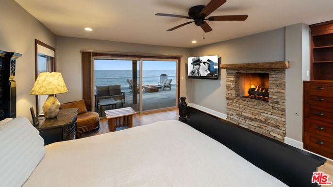 Bedroom, Fireplace, Interior, Recessed Lighting, Stone Walls, Water, Wood Texture Flooring
