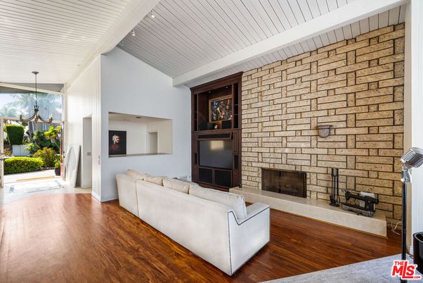 Fireplace, Interior, Living room, Recessed Lighting, Stone Walls, Wood Texture Flooring