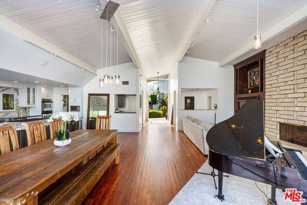Dining room, Fireplace, Interior, Kitchen, Living room, Pendant Lights, Piano, Recessed Lighting, Stone Walls, Wood Texture Flooring