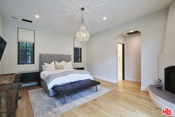 Bedroom, Chandelier, Fireplace, Interior, Recessed Lighting, Wood Texture Flooring